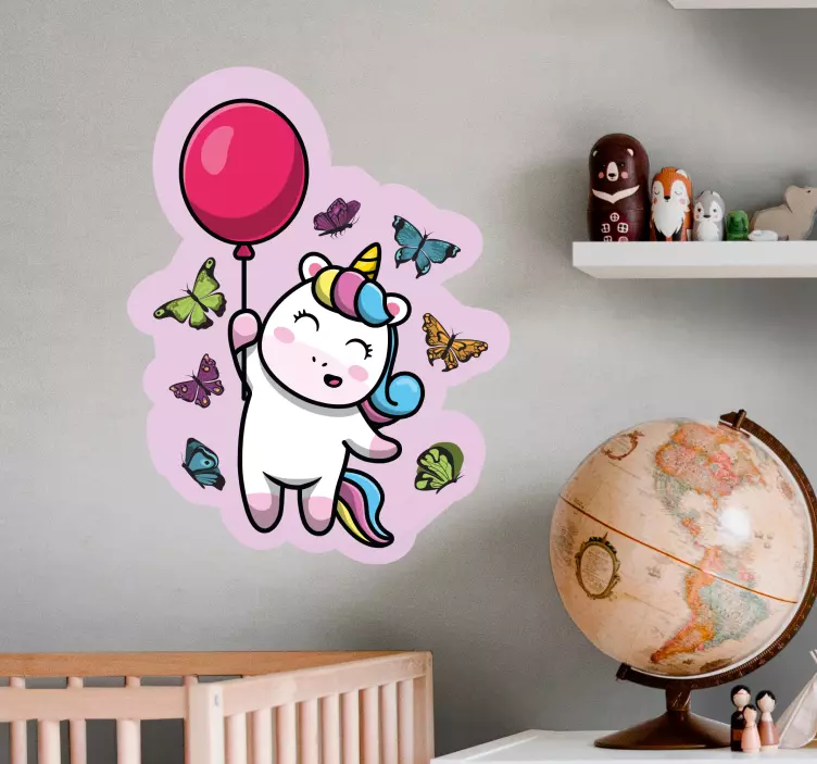 Vinilo infantil para pared unicornio juguetón con globo - TenVinilo