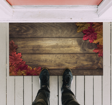 Alfombra vinílica entrada madera con hojas otoño - TenVinilo